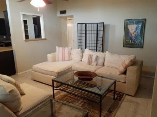 2714 McCart Avenue, Unit 2712 Fort Worth, TX 76110 - Photo 28 of 39 a living room with furniture and a window