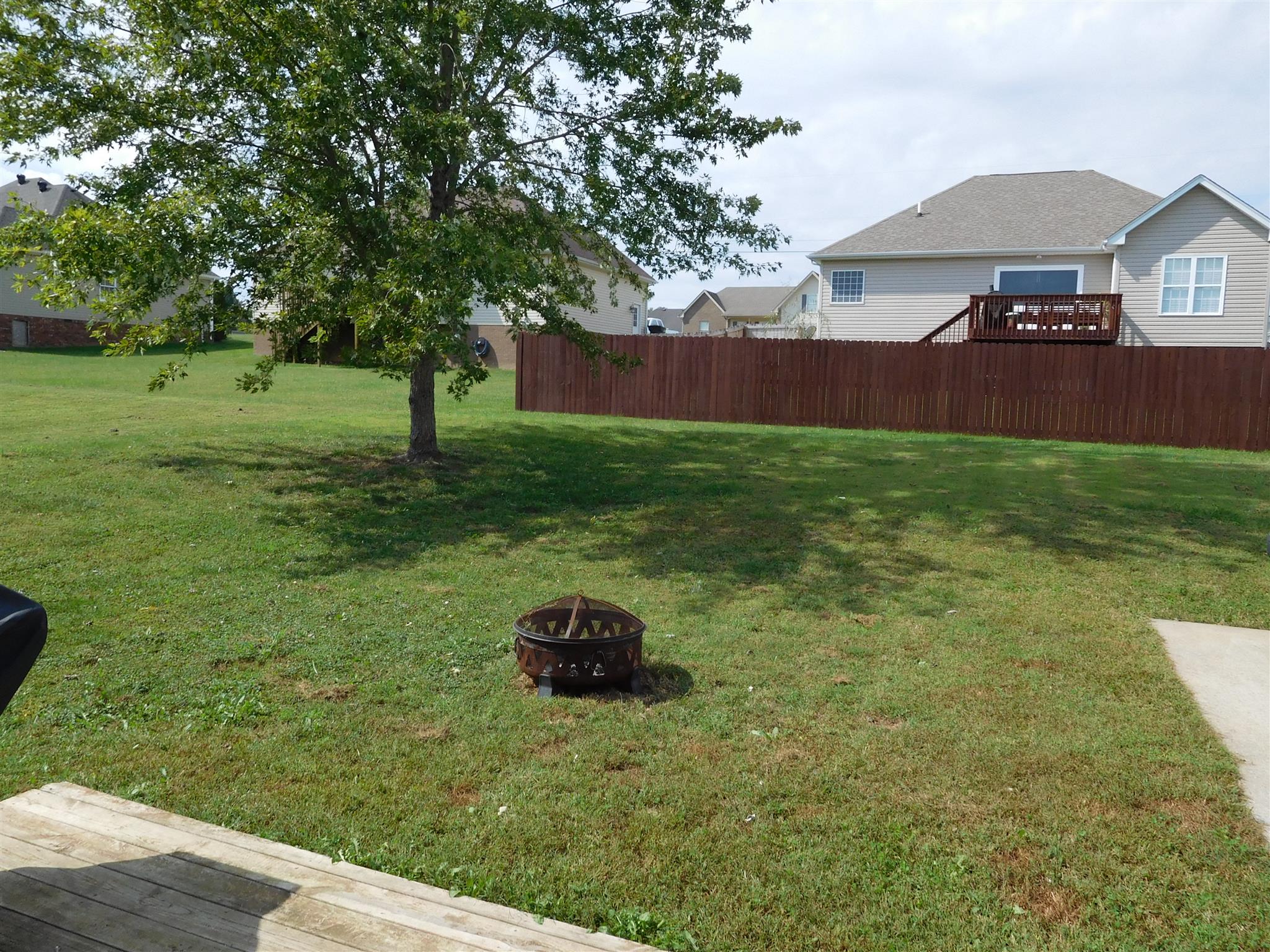 108 Filly Lane Springfield, TN 37172 - Photo 16 of 16 a backyard of a house with table and chairs