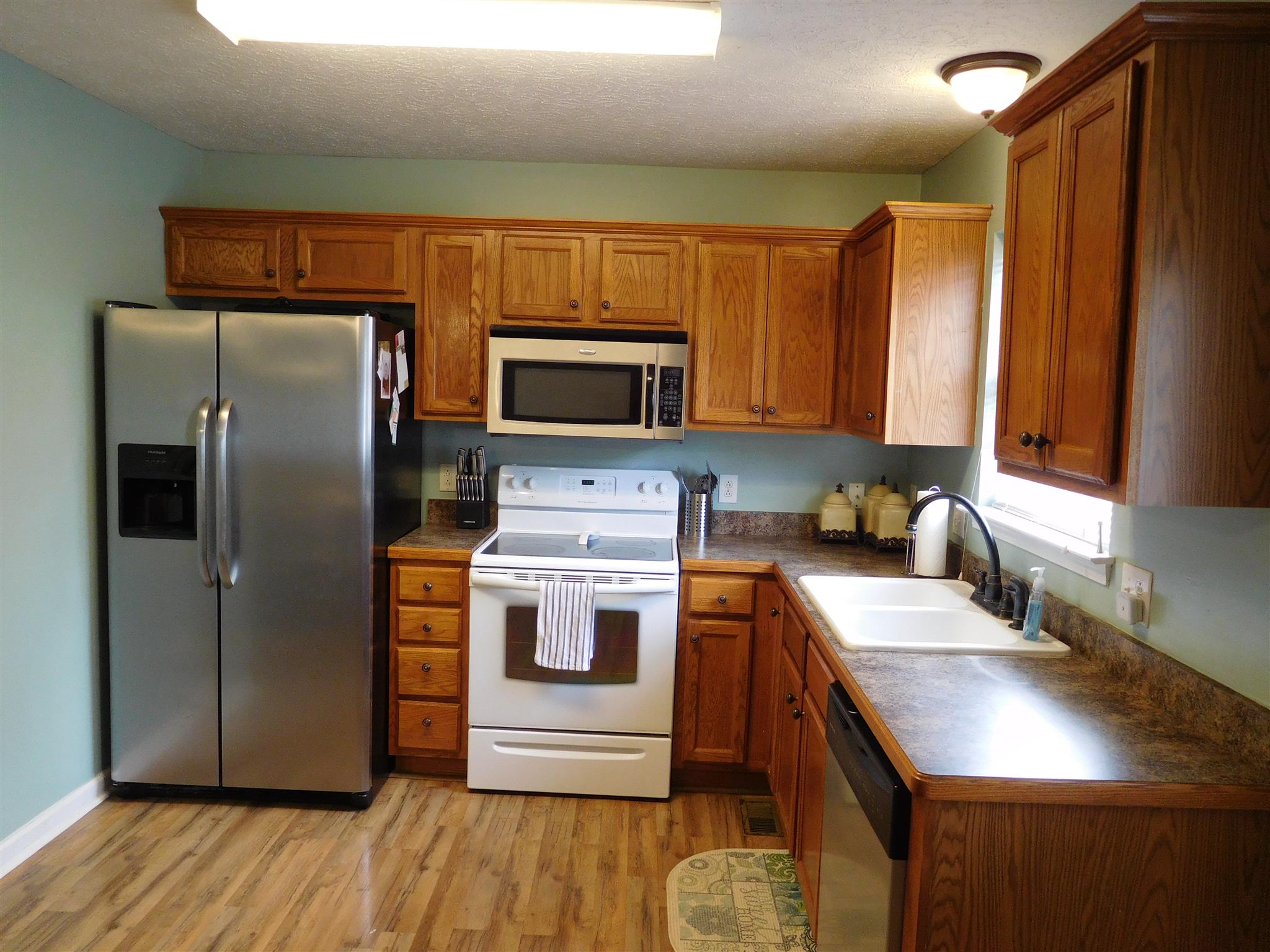 108 Filly Lane Springfield, TN 37172 - Photo 5 of 16 a kitchen with a refrigerator sink and microwave