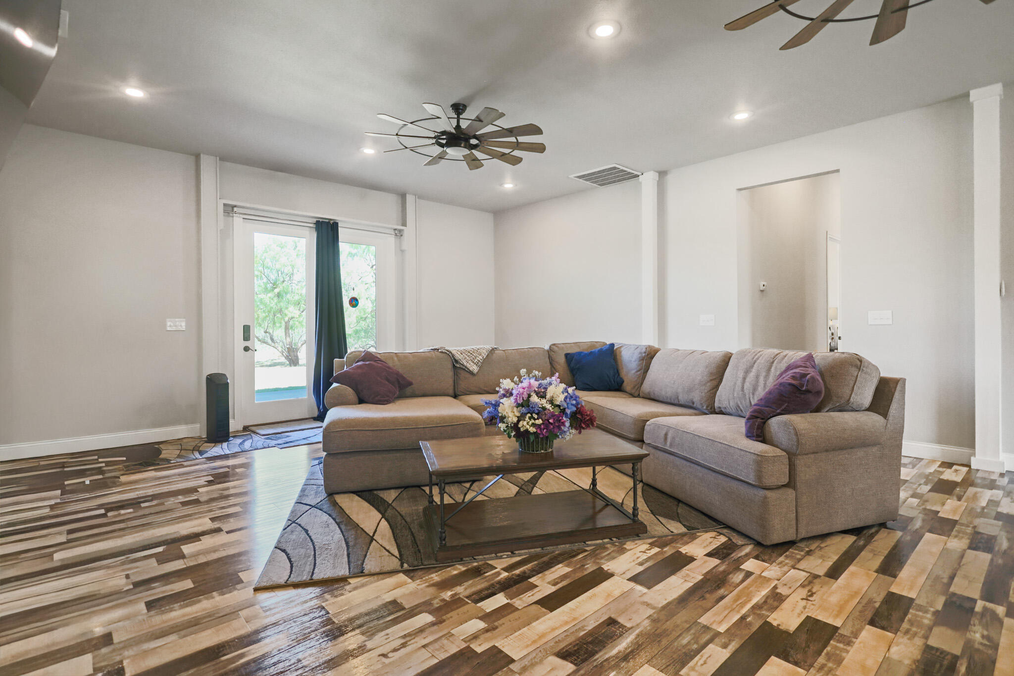 301 Fagan Road Snyder, TX 79549 - Photo 24 of 102 a living room with furniture and a chandelier