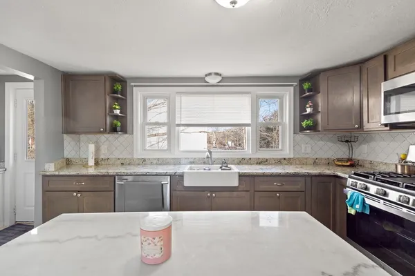 a kitchen with counter top space and sink