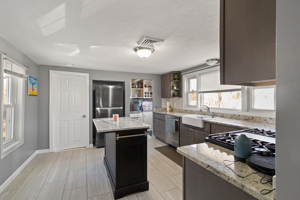 48 Wall Street Bridgewater, MA 02324 - Photo 14 of 29 a kitchen with counter top space and sink