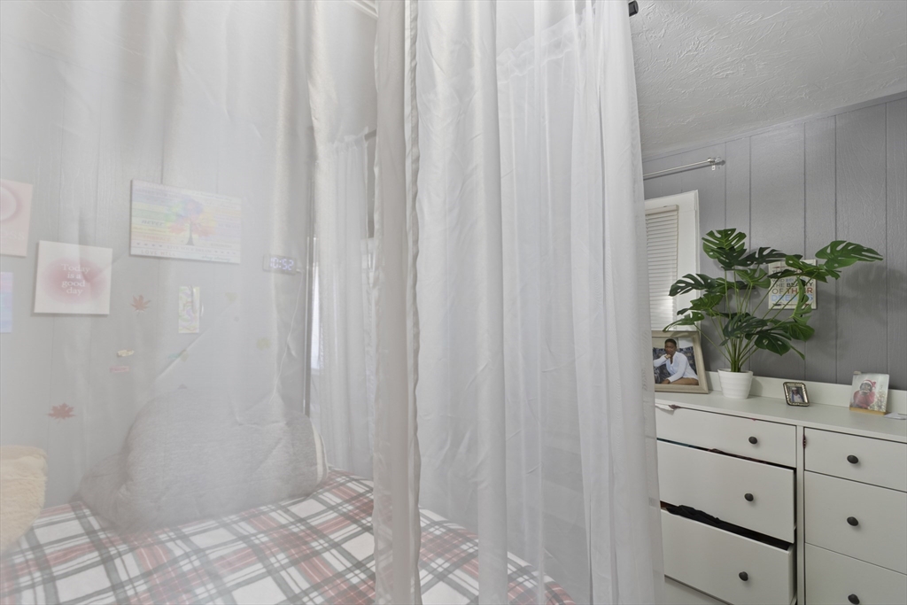 48 Wall Street Bridgewater, MA 02324 - Photo 17 of 29 a bathroom with a shower curtain and mirror