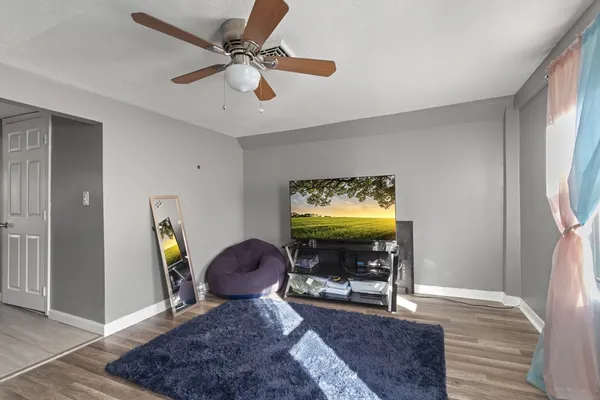 a view of a livingroom with furniture and wooden floor