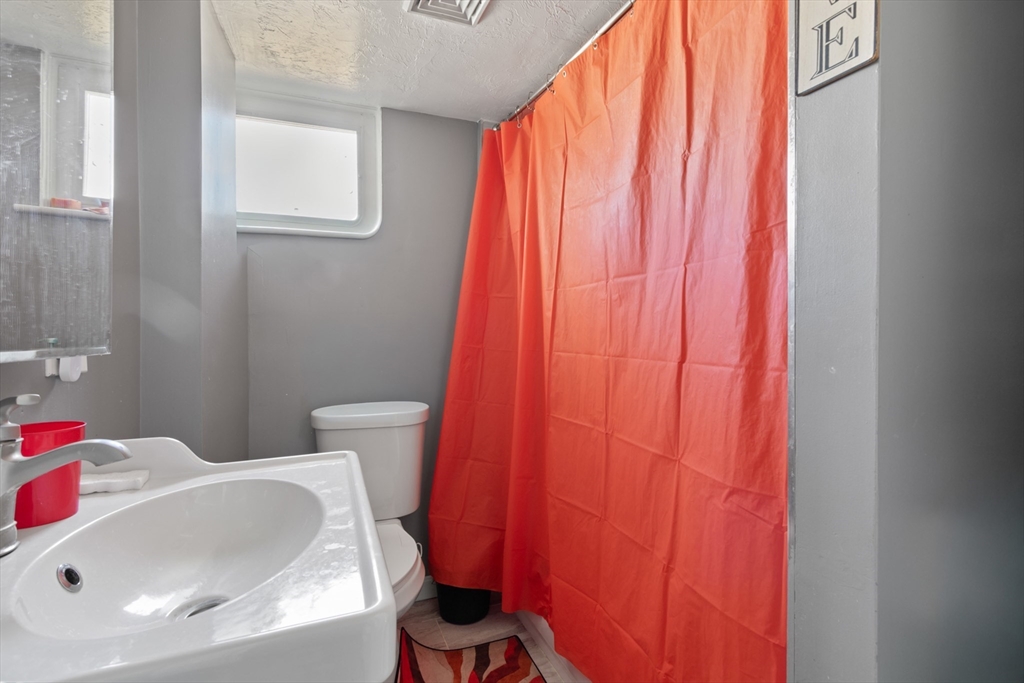 48 Wall Street Bridgewater, MA 02324 - Photo 22 of 29 a bathroom with a sink and toilet
