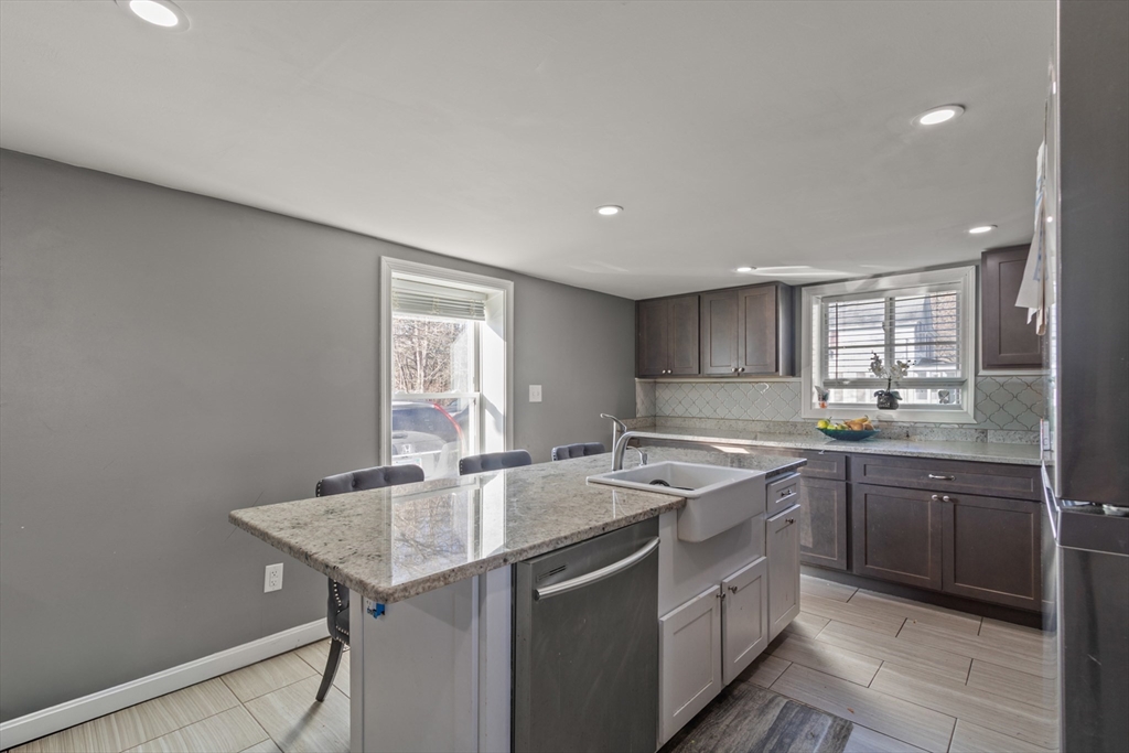 48 Wall Street Bridgewater, MA 02324 - Photo 3 of 29 a kitchen with a sink and cabinets