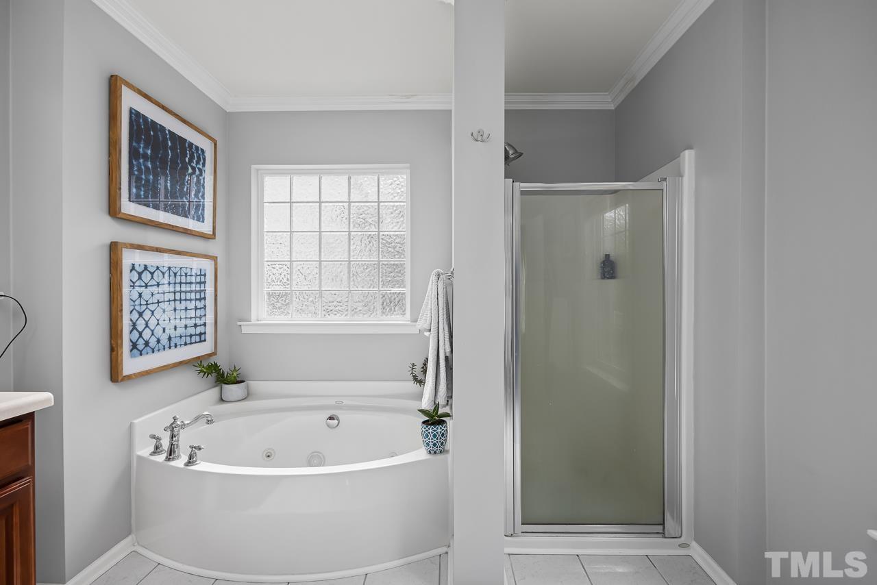 2836 Roundleaf Court Raleigh, NC 27604 - Photo 24 of 39 a white bath tub sitting next to a window