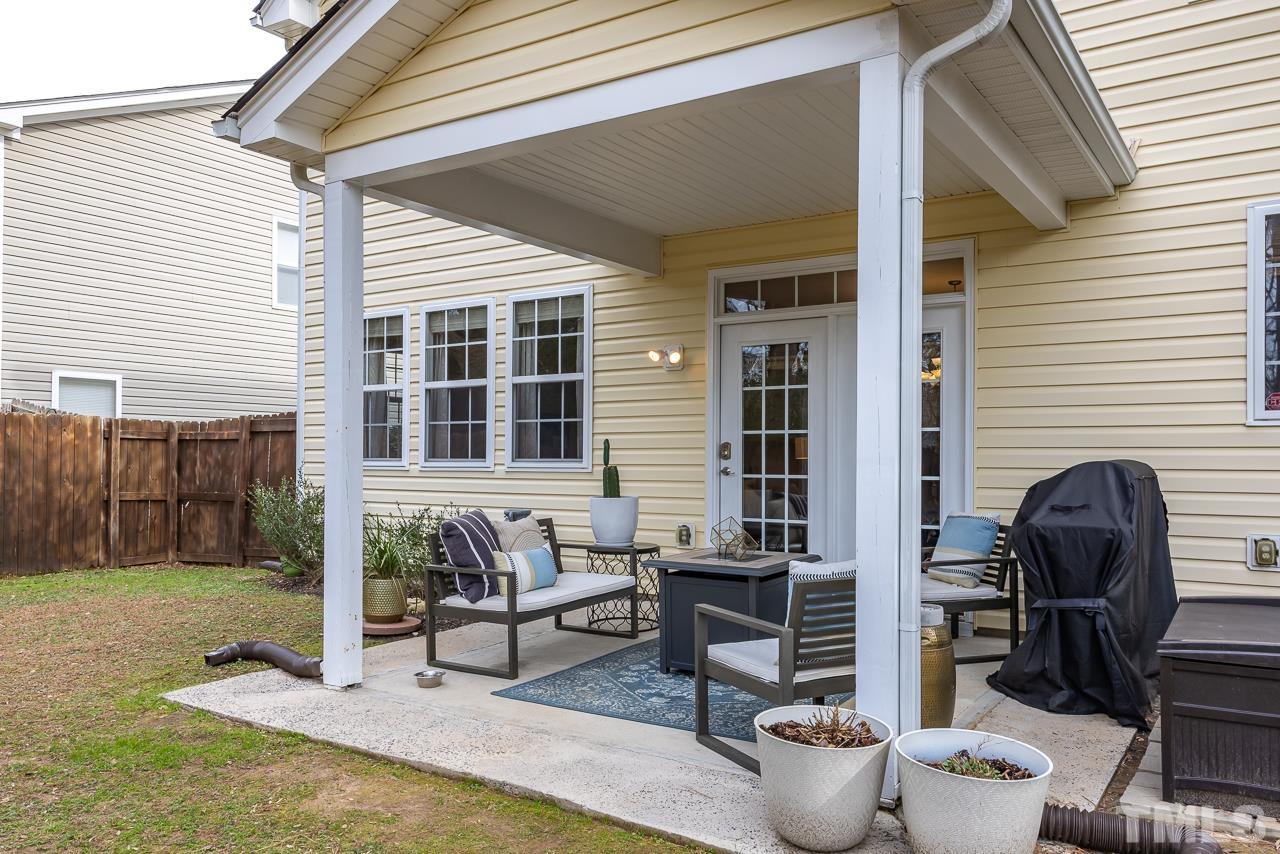 2836 Roundleaf Court Raleigh, NC 27604 - Photo 32 of 39 a view of a patio with couches chairs and potted plants
