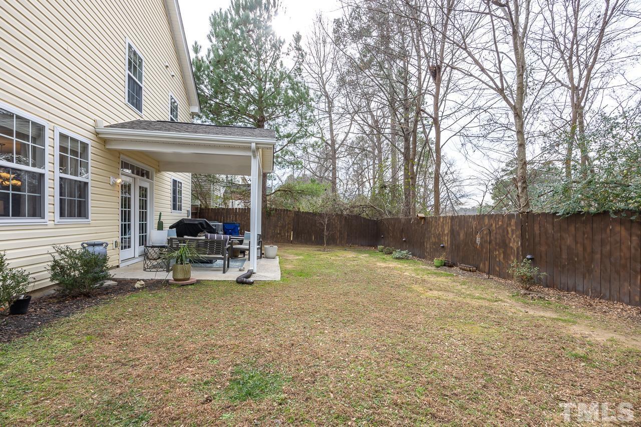 2836 Roundleaf Court Raleigh, NC 27604 - Photo 35 of 39 a view of a chair and table in backyard of the house