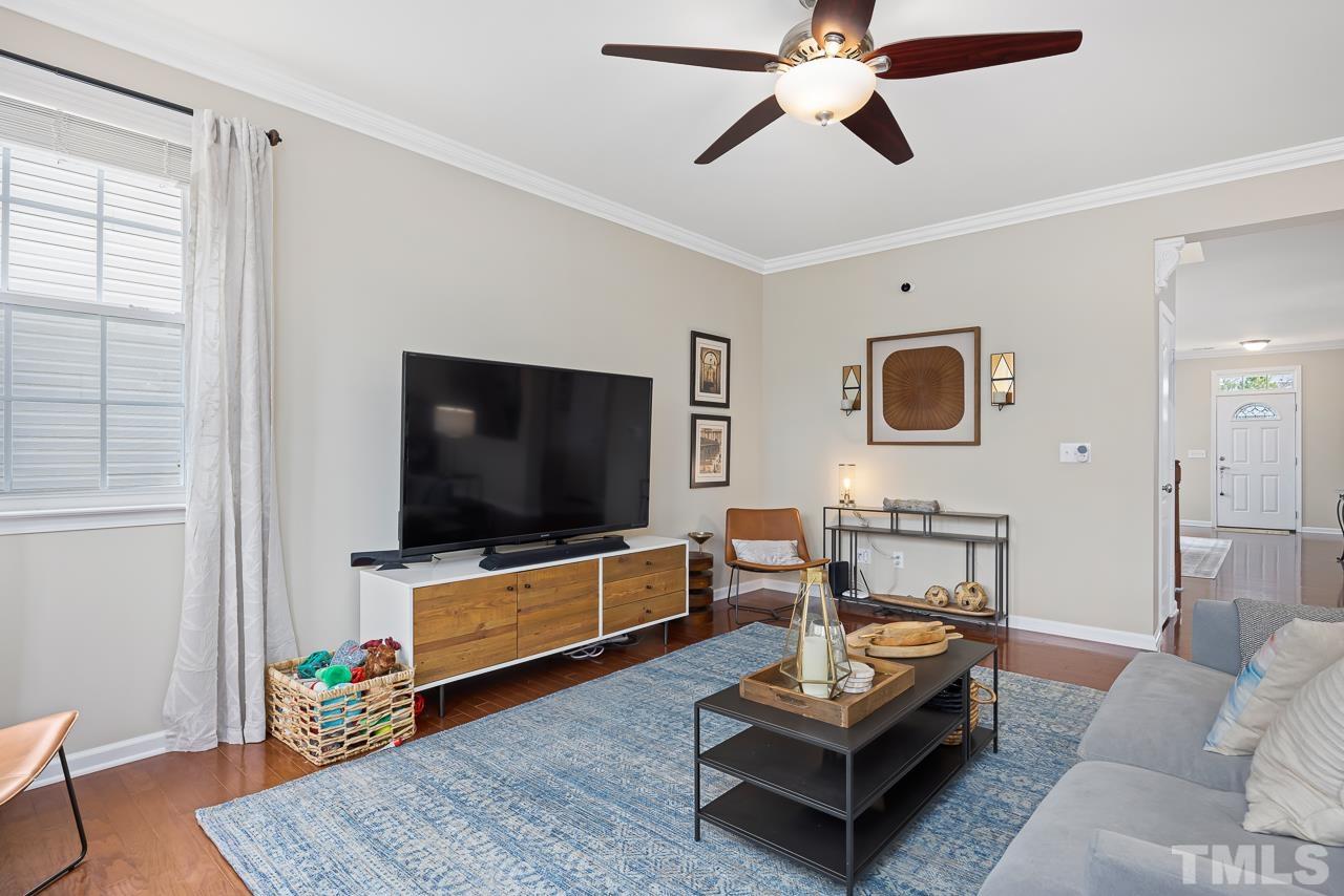 2836 Roundleaf Court Raleigh, NC 27604 - Photo 5 of 39 a living room with furniture and a flat screen tv