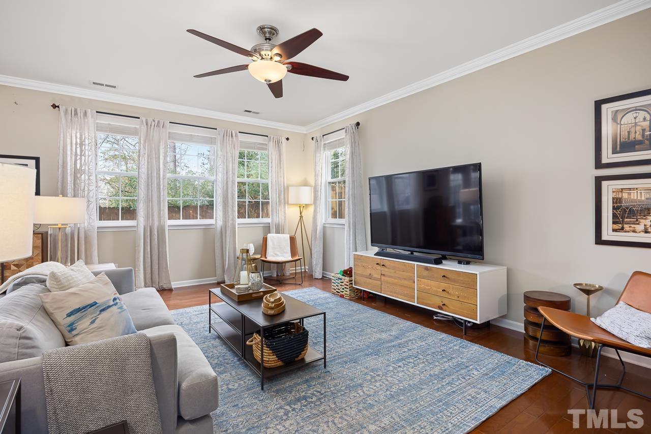 2836 Roundleaf Court Raleigh, NC 27604 - Photo 6 of 39 a living room with furniture and a flat screen tv