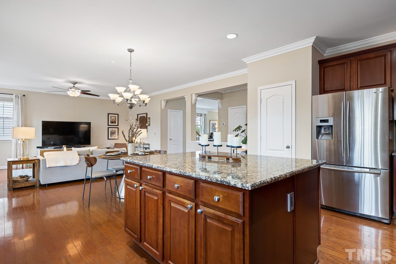2836 Roundleaf Court Raleigh, NC 27604 - Photo 8 of 39 a kitchen with stainless steel appliances granite countertop a sink refrigerator stove and microwave