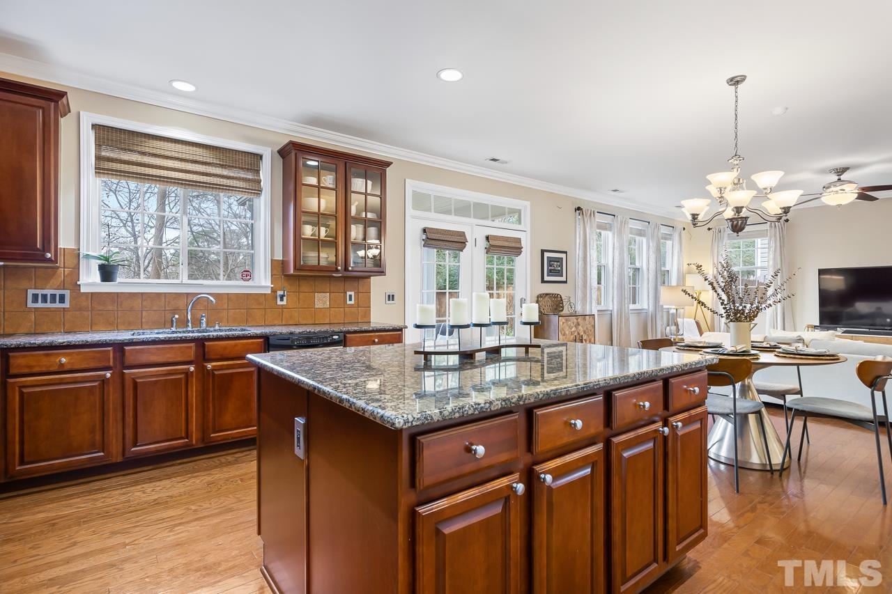 2836 Roundleaf Court Raleigh, NC 27604 - Photo 10 of 39 a kitchen with lots of counter top space and dining table