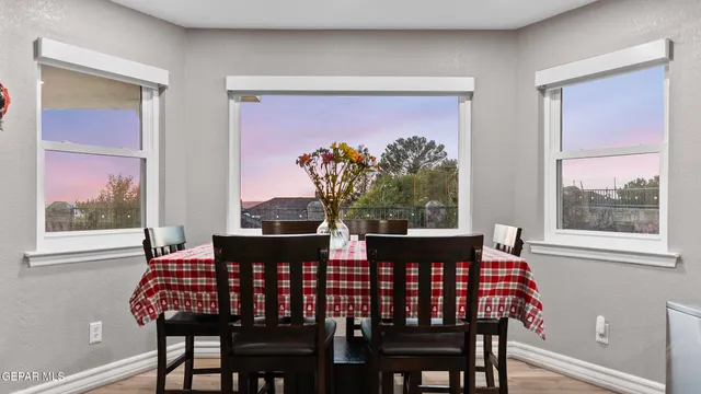 a large white bathroom with a sink a large mirror and a shower