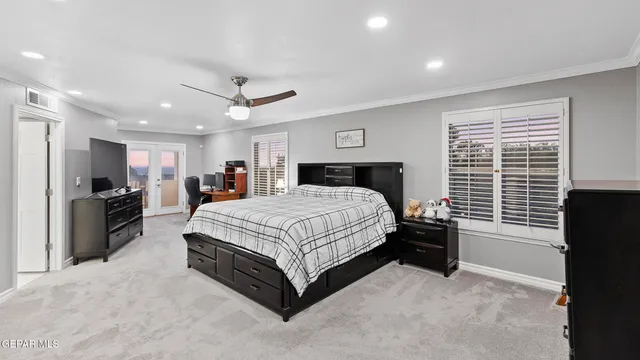 a bedroom with a bed and a couch