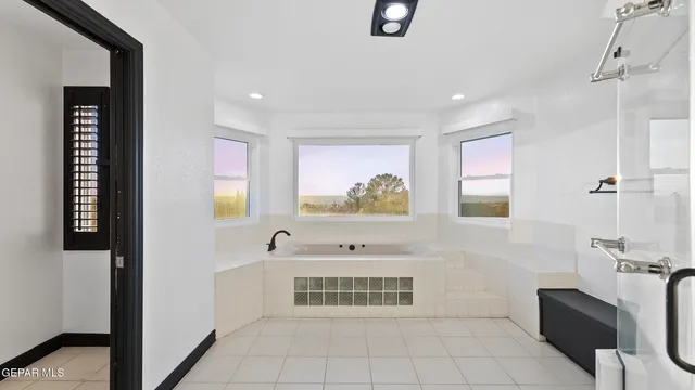 a bedroom with a bed and a ceiling fan