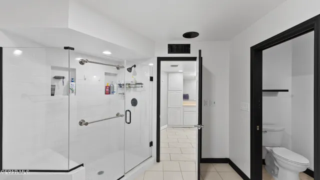 a view of washer and dryer with wooden floor