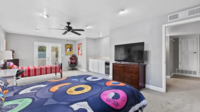 a view of a chairs and table in patio with a yard