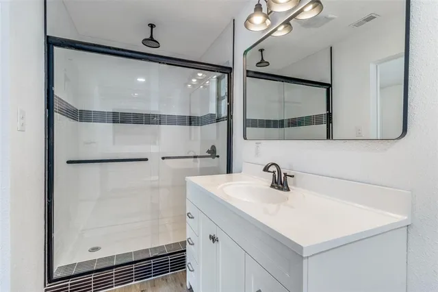 a view of a kitchen with a dishwasher and a refrigerator