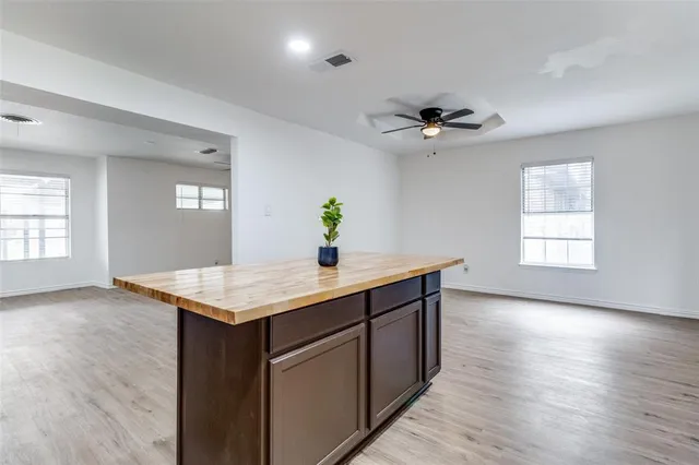 a view of a backyard with large trees