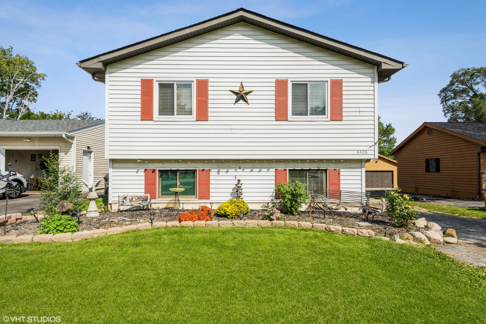 8408 Coral Road Wonder Lake, IL 60097 - Photo 1 of 15 a front view of house with yard and outdoor seating