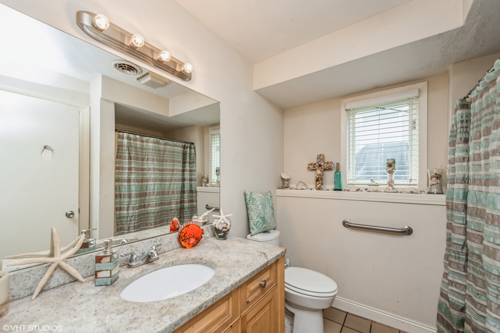 8408 Coral Road Wonder Lake, IL 60097 - Photo 12 of 15 a bathroom with a granite countertop sink a toilet a large mirror and shower