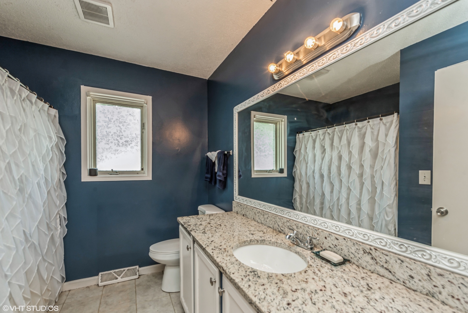 8408 Coral Road Wonder Lake, IL 60097 - Photo 13 of 15 a bathroom with a granite countertop sink vanity mirror and toilet