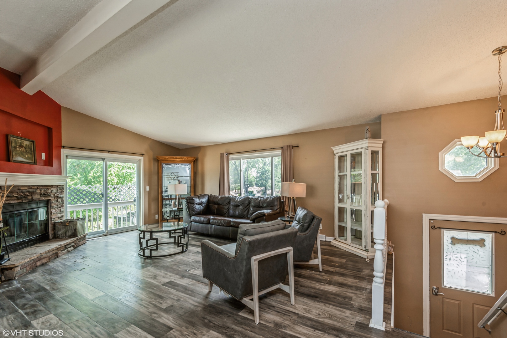 8408 Coral Road Wonder Lake, IL 60097 - Photo 3 of 15 a living room with furniture flat screen tv and a fireplace