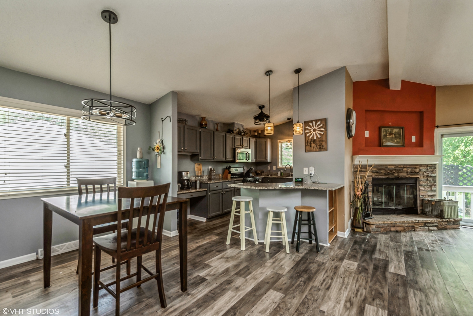 8408 Coral Road Wonder Lake, IL 60097 - Photo 4 of 15 a open kitchen with stainless steel appliances granite countertop a stove and a wooden floor
