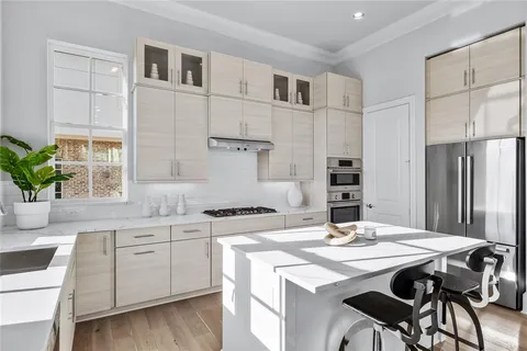 a kitchen that has a cabinets and a stove