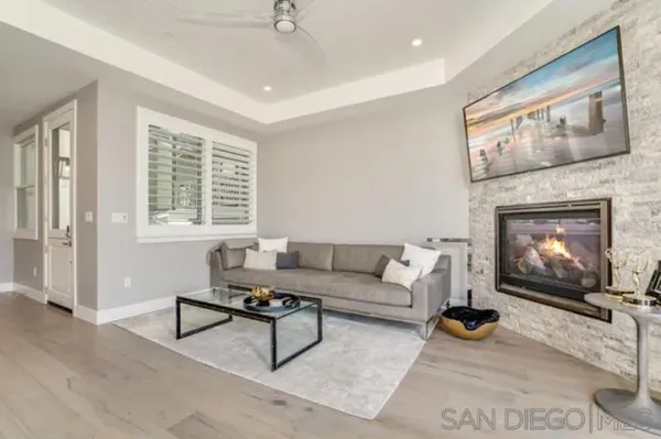 a bathroom with a granite countertop toilet sink and mirror