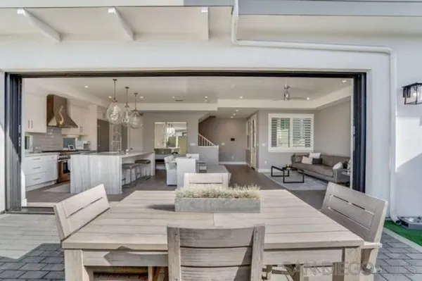 a bedroom with a bed lamp and a window