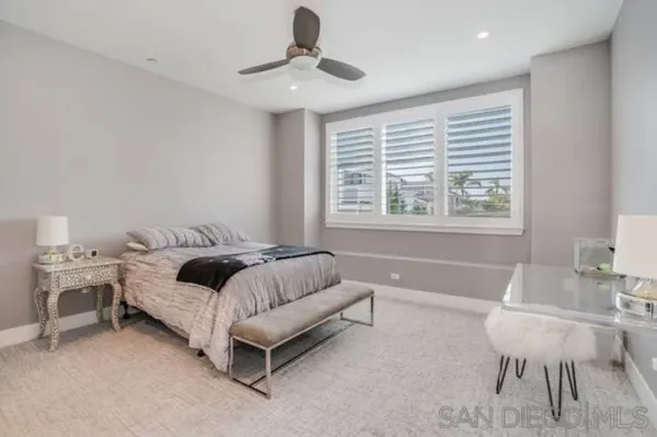 a bedroom with bed and a table