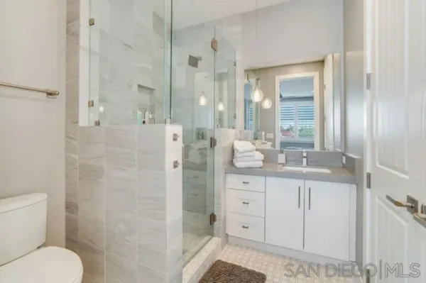 a bedroom with a bed and a table