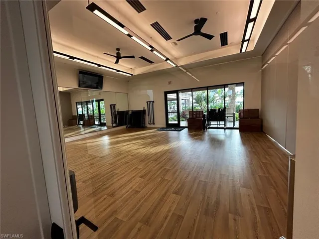 a kitchen with stainless steel appliances kitchen island granite countertop a sink dishwasher stove and cabinets
