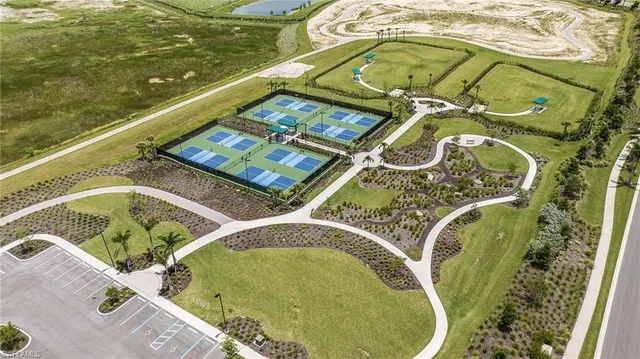 a view of swimming pool with a garden and seating