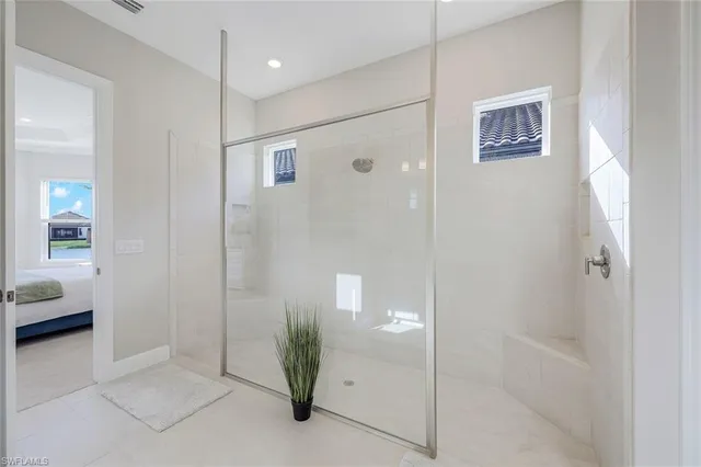 a bathroom with a shower and a sink