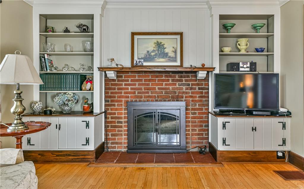 237 Clearview Road Pittsburgh, PA 15202 - Photo 9 of 25 Wood burning fireplace and built-ins keep the farmhouse feel alive.