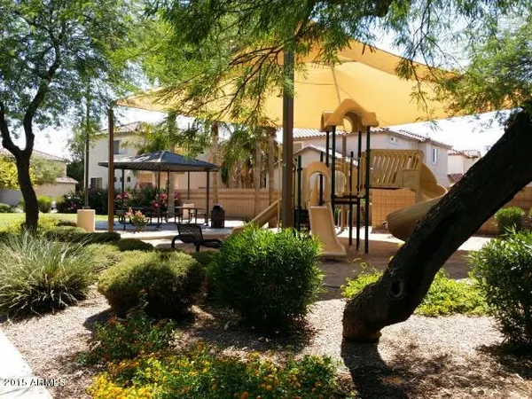 a view of a garden with sitting area