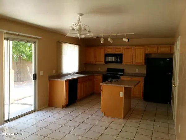 a kitchen with a cabinets and steel appliances