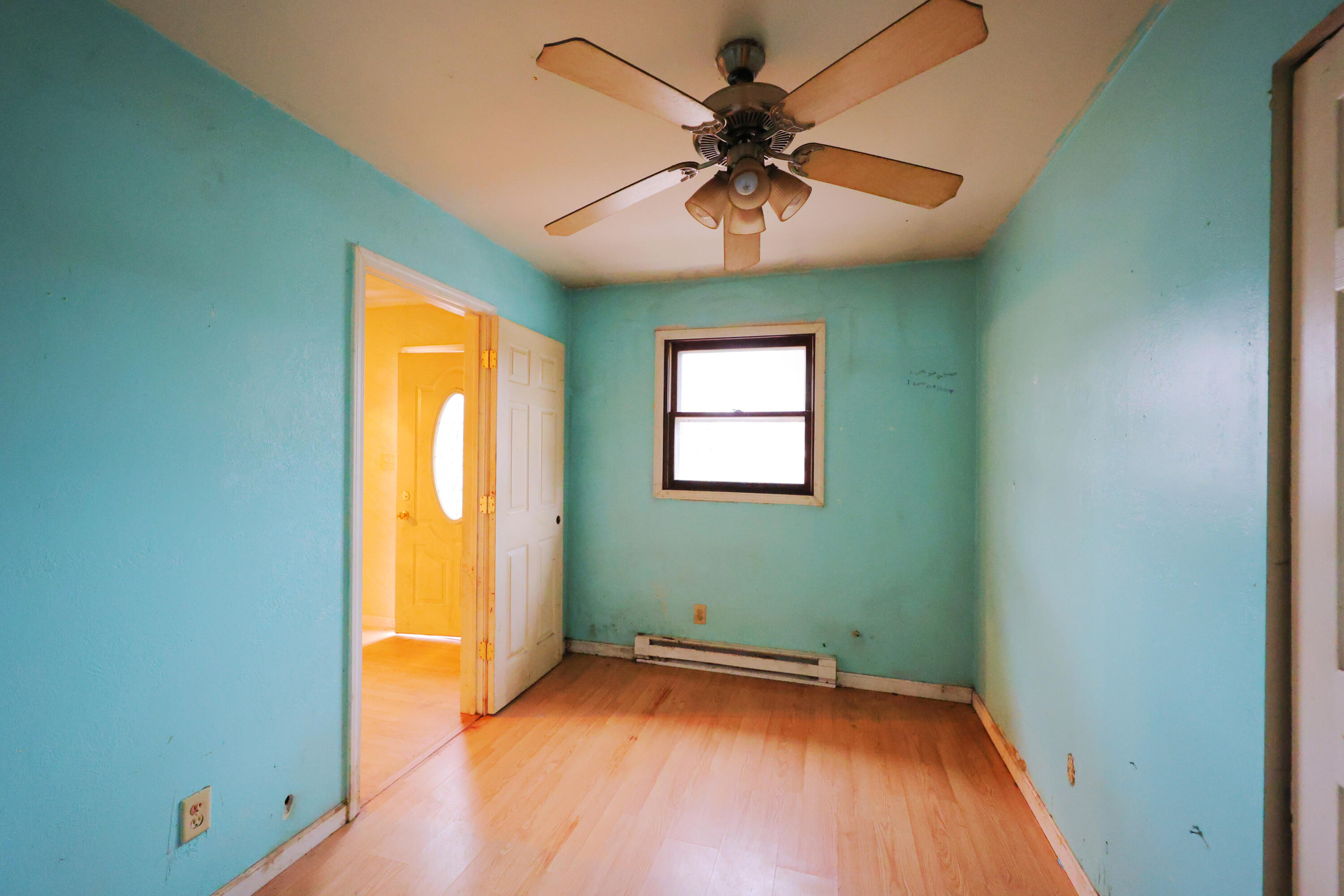 2627 Birch Tree Lane Demotte, IN 46310 - Photo 20 of 23 an empty room with a ceiling fan and a window