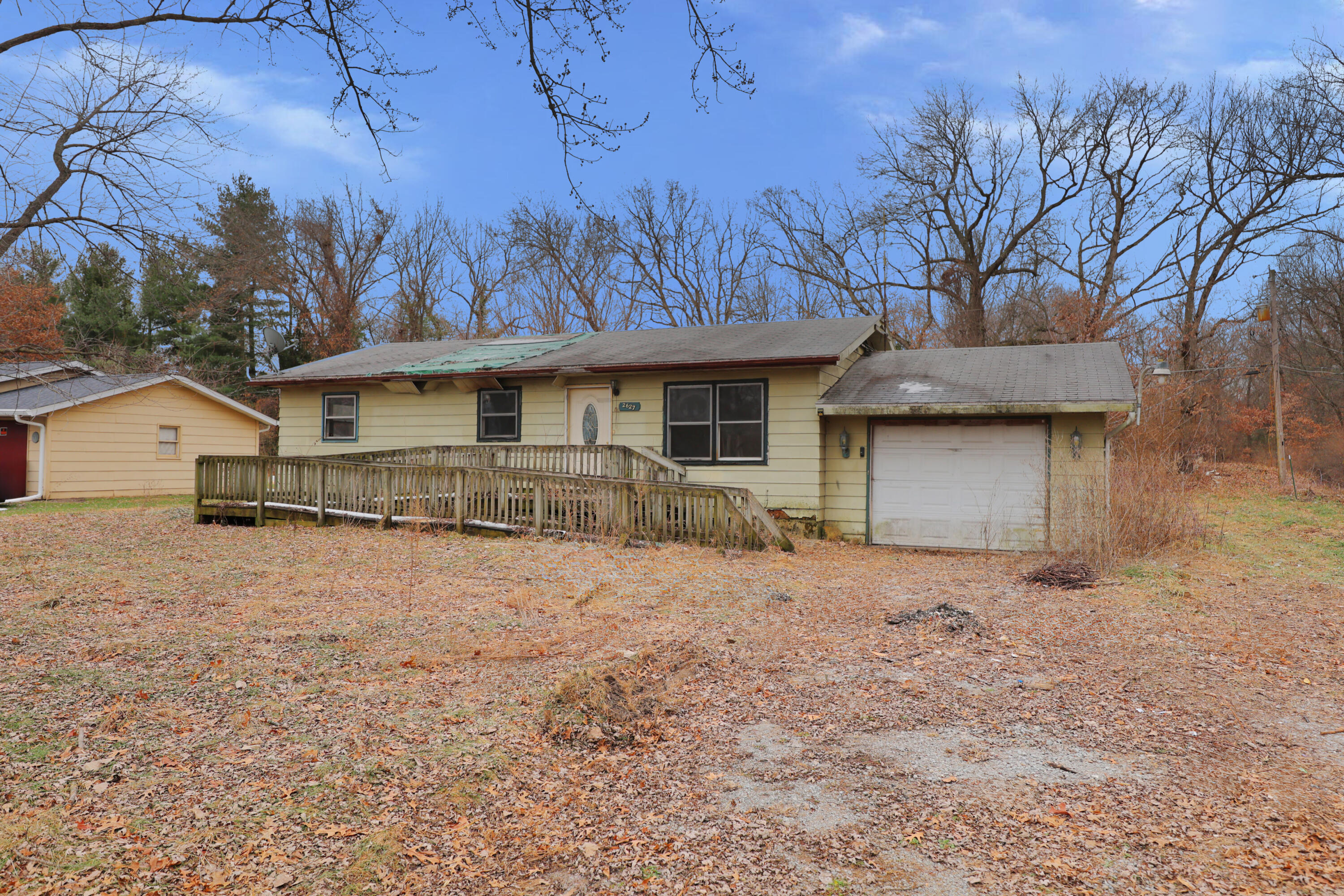 2627 Birch Tree Lane Demotte, IN 46310 - Photo 2 of 23 a front view of a house with a yard and garage