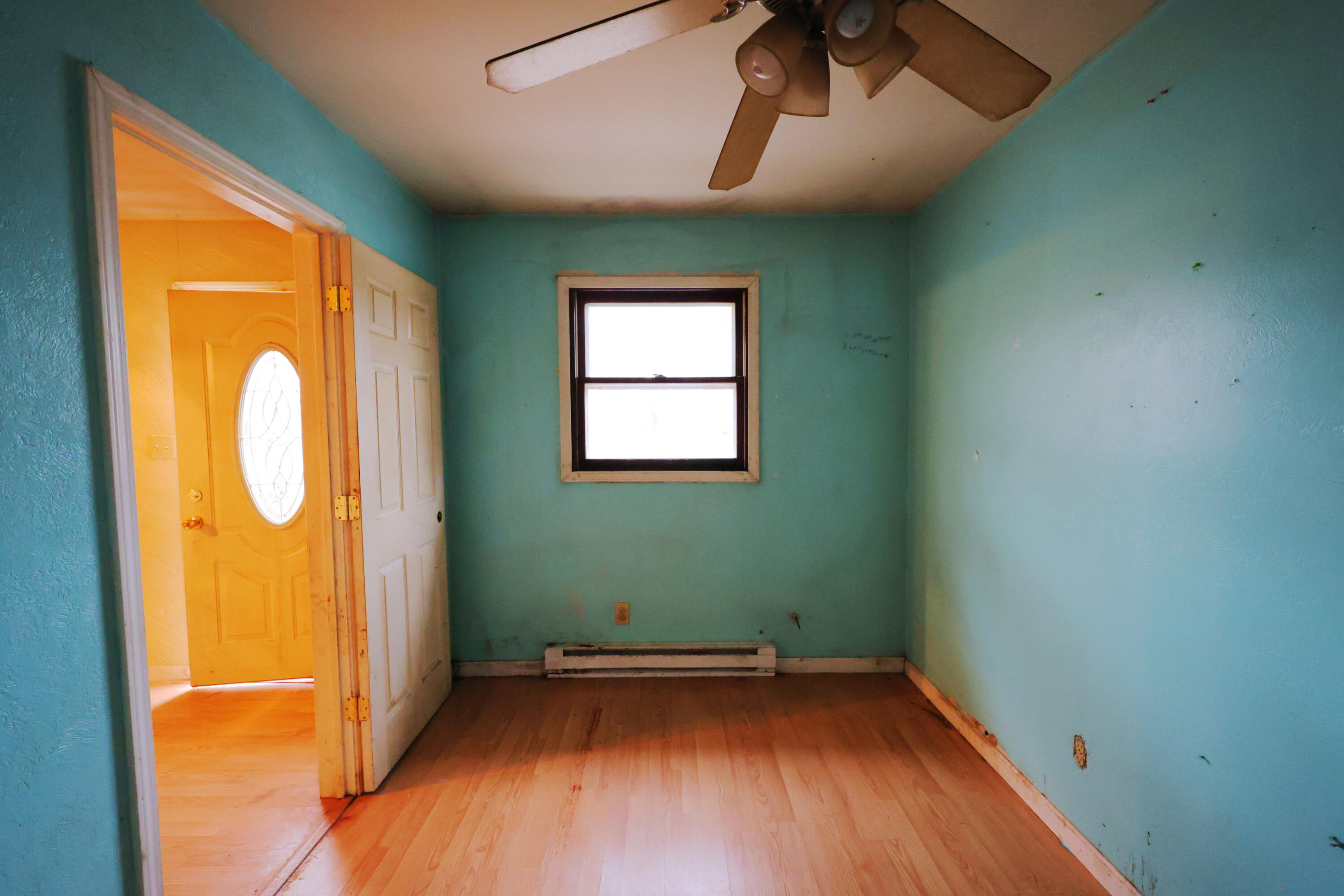 2627 Birch Tree Lane Demotte, IN 46310 - Photo 21 of 23 an empty room with a window and wooden floor