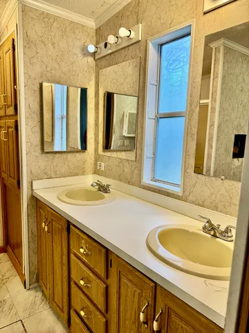 a white toilet sitting next to a bathroom sink