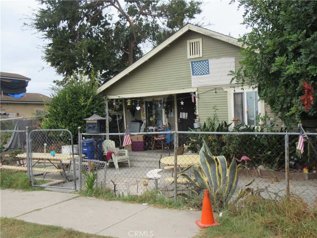 a view of house with a patio