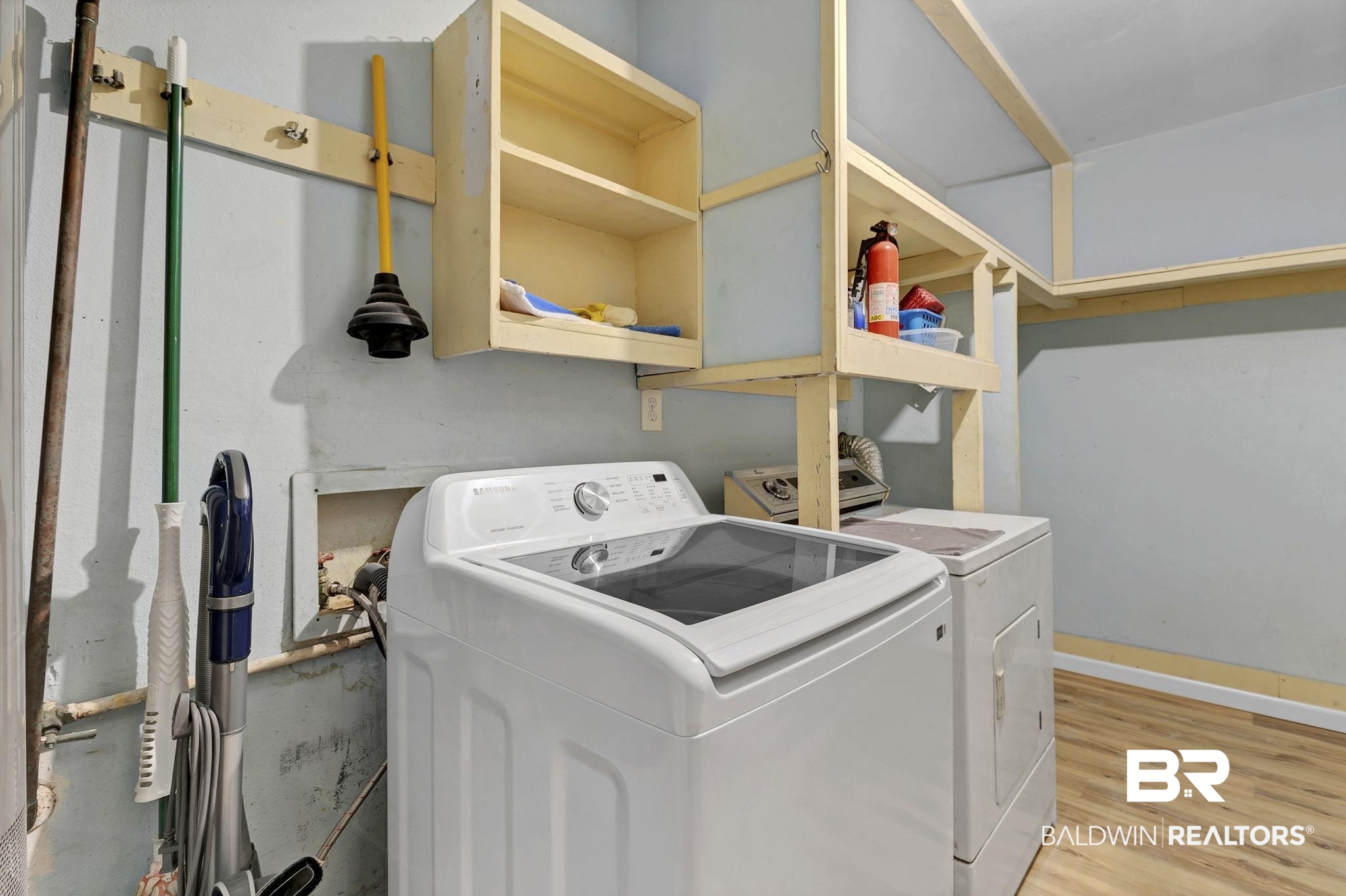 5817 Woodgate Road Mobile, AL 36609 - Photo 60 of 85 Laundry room featuring light wood-style floors, laundry area, and separate washer and dryer
