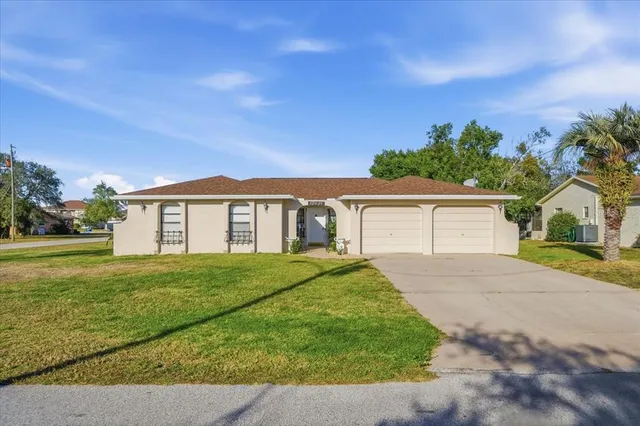 front view of a house with a yard