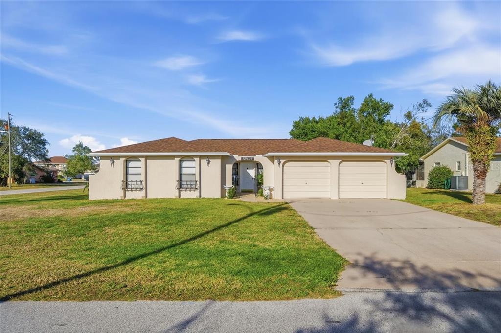 front view of a house with a yard