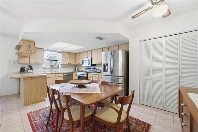 a dining room with furniture and window
