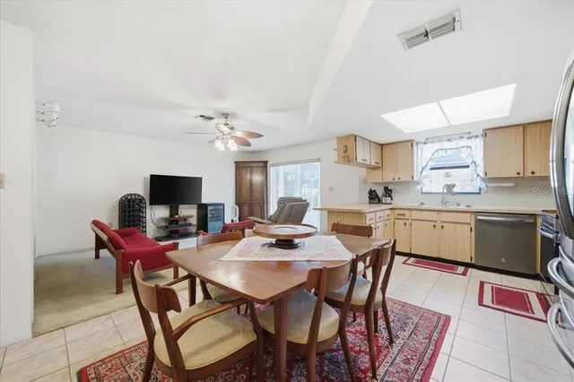 a kitchen with a dining table and chairs